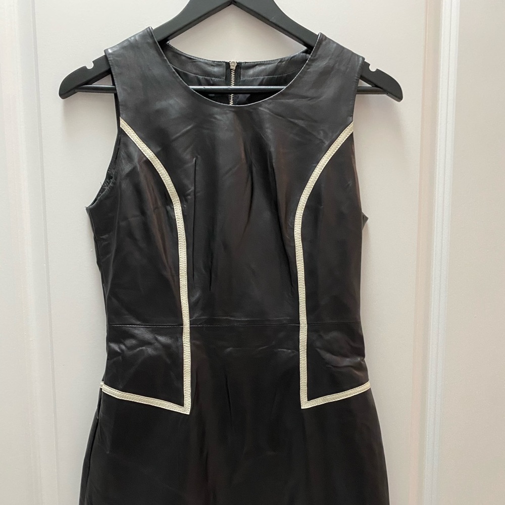 Black leather dress with fur at the bottom